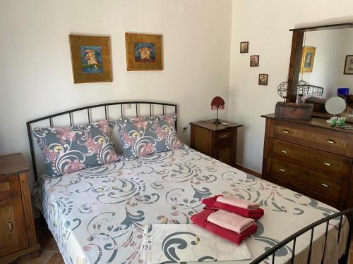 a bedroom with a bed with two pillows on it at ANASTASIAS HOUSE in Agios Nikolaos