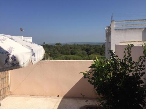 a view of a building with a wall at Villa Said in Moulay Bousselham