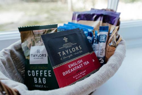 a basket filled with books in a window at Hall View Guest Suite in Nunnington