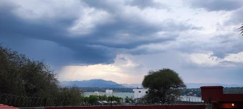 a cloudy sky with a view of a body of water at Blessed Rest Home Teques in Tequesquitengo