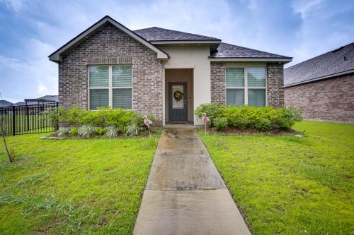 a brick house with a pathway leading to the front door at Baton Rouge Vacation Rental 5 Mi to LSU! in Baton Rouge