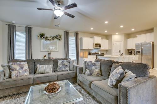 a living room with two couches and a ceiling fan at Baton Rouge Vacation Rental 5 Mi to LSU! in Baton Rouge