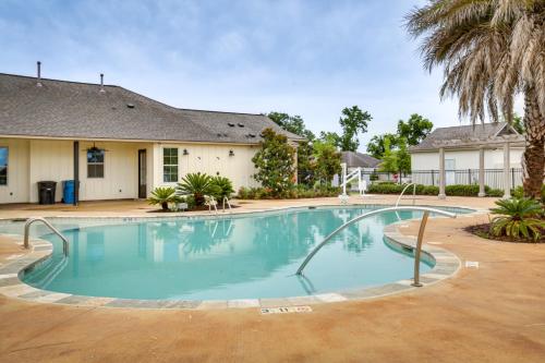 a large swimming pool in front of a house at Baton Rouge Vacation Rental 5 Mi to LSU! in Baton Rouge