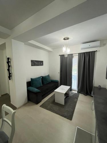 a living room with a couch and a table at Apartments IVI Gevgelija in Gevgelija