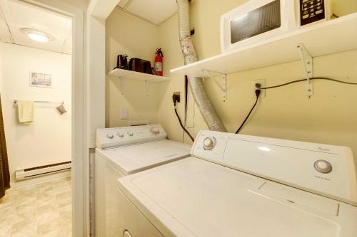 a white laundry room with a washer and dryer at Hannahs Place - Quaint and Cozy Apt by the Beach! in Emerald Isle