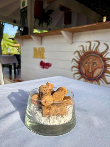 a glass bowl filled with cookies on a table at 21 Palms in Las Galeras