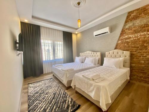 Postel nebo postele na pokoji v ubytování Kesik Apart
