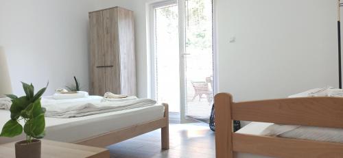 Postel nebo postele na pokoji v ubytování Sunčani apartman 2