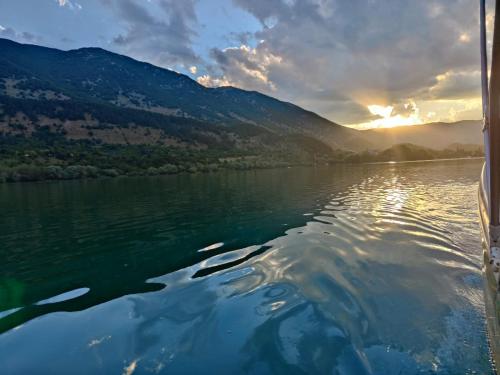 a view from a boat on a lake at sunset at Casa Scanno centro storico in Scanno