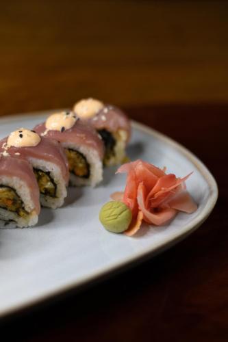 a plate of sushi with meat and vegetables on it at Hotel Playa Cambutal in Cambutal
