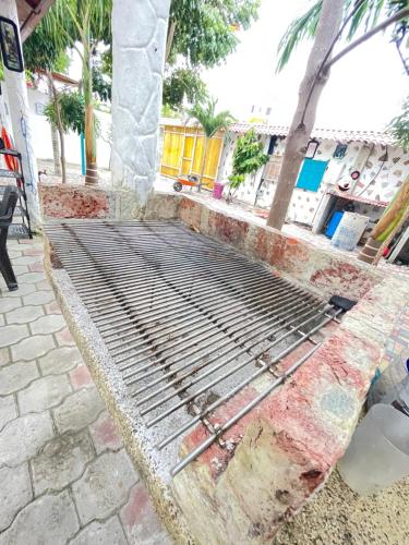 a metal bed on the side of a beach at Casa Halley #2 con vista al mar , Playas in Data de Posorja