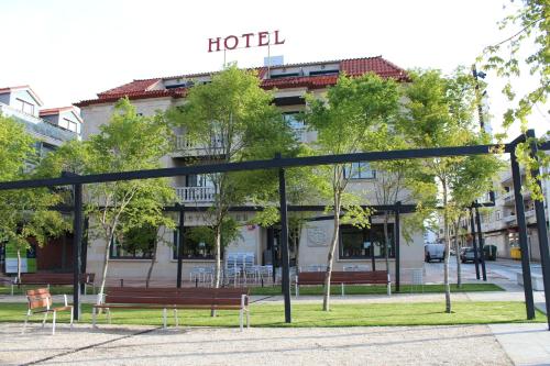 a hotel sign in front of a building at Nueva Colina in Tomiño