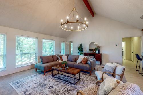 a living room with a couch and a table at Brazos de Dios in Glen Rose