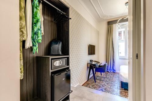 a hotel room with a kitchen and a room at Arenula Suites in Rome