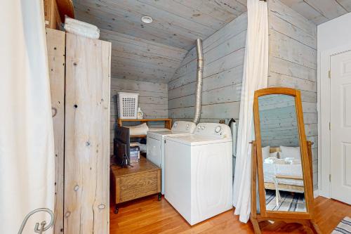 a laundry room with a washer and dryer at Island Time in Vineyard Haven