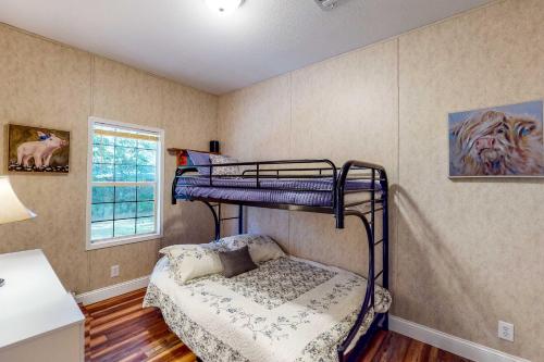 a bedroom with a bunk bed in a room at Gallop Away in Williston