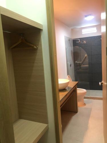 a bathroom with a shower and a sink and a toilet at Hostel paradise St in Santa Marta