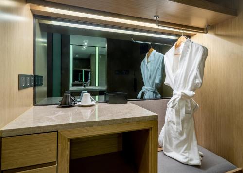 a bathroom with a sink and a mirror at Zenith Hotel-Near Train Station & The Mixc in Xiamen