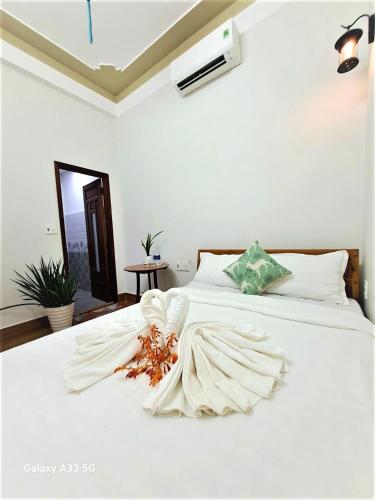 Ένα ή περισσότερα κρεβάτια σε δωμάτιο στο Cong Man Homestay Cham Island