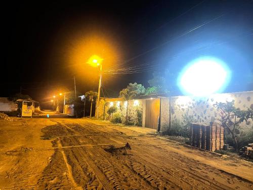 a dirt road at night with a street light at Casa Halley #2 con vista al mar , Playas in Data de Posorja