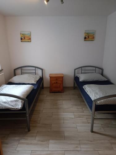 Giường trong phòng chung tại Końskie Zacisze
