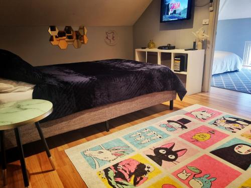 a bedroom with a bed and a rug on the floor at Dreamhouse in Melbourne
