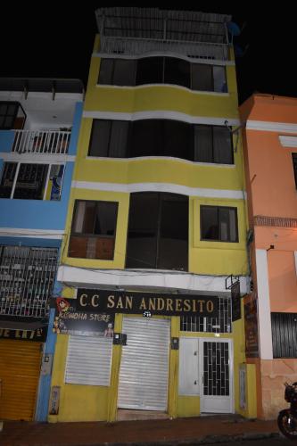 a yellow building with a sign that reads c san amnesia at Tranquilo y Acogedor Apto en Fusagasugá. in Fusagasuga