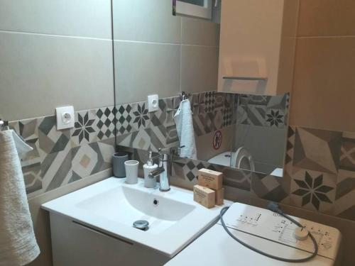 a bathroom with a sink and a mirror at Beauty Greece in Athens