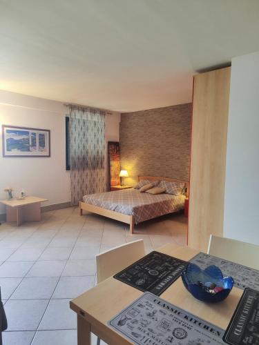 a hotel room with a bed and a table at Agape in Marco Simone