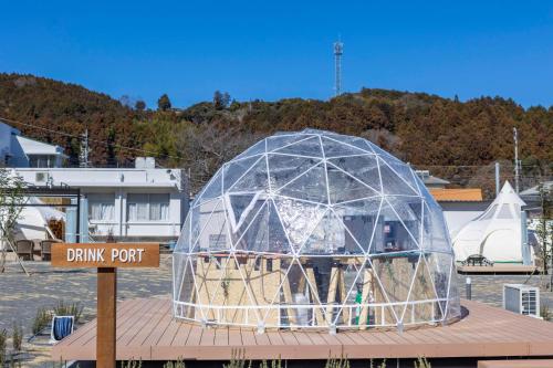 a glass dome on top of a building at Glamping&Port結 in Shimada
