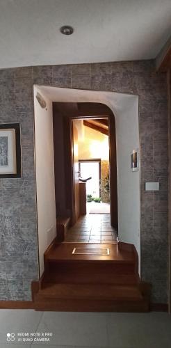 a hallway with stairs leading into a house at Private Romantic Wellness Lake View Retreat- Whirlpool Hammam Spa e Piscina panoramica in Maccagno con Pino e Veddasca