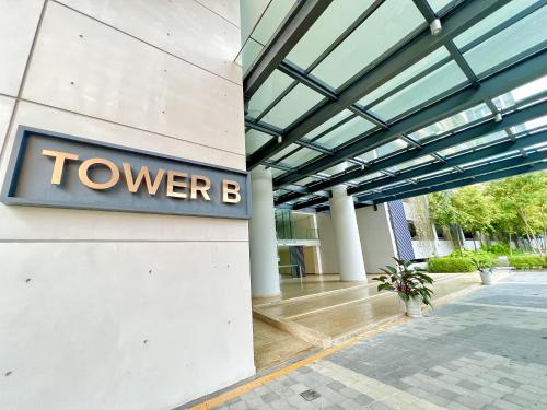 a building with a towerb sign on the side of it at Grand Medini Residence by Luxecocoo CK Legoland in Nusajaya