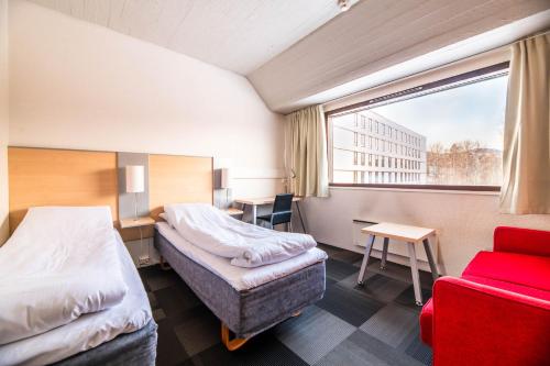 En eller flere senger på et rom på Bø Hotel