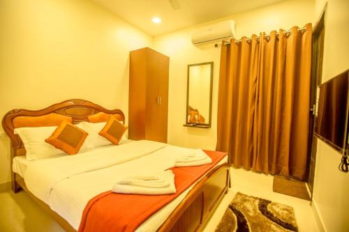 Hotel Royal Elite Maduraiにあるベッド