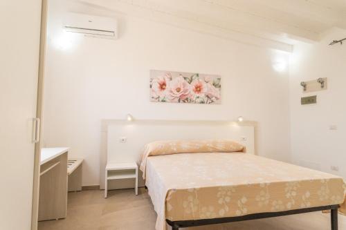 Ένα ή περισσότερα κρεβάτια σε δωμάτιο στο Appartamenti Costanza