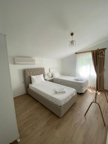 Postel nebo postele na pokoji v ubytování Melisa Hotel