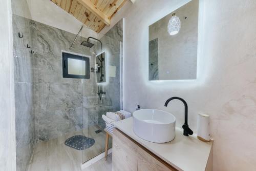 a bathroom with a sink and a shower at Olive Hills Holiday homes in Bar