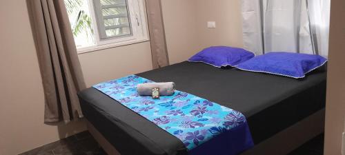 Llit o llits en una habitació de Bora Temahana