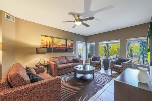 a living room with furniture and a ceiling fan at Villa Toscana condo in Phoenix