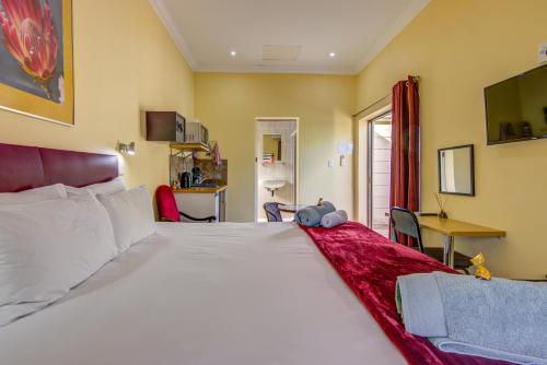 Un ou plusieurs lits dans un hébergement de l'établissement Edenvale Guest House