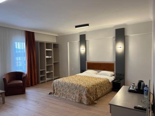 Posteľ alebo postele v izbe v ubytovaní GRAND KENT OTEL