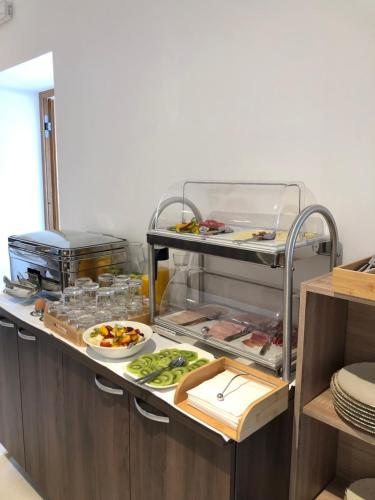 a kitchen with a buffet of food on a counter at Šangulin Palace M in Biograd na Moru