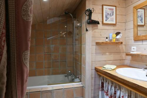 a bathroom with a shower and a tub and a sink at Le Vallorcin, chalet le Sizeray - Mont Blanc in Vallorcine