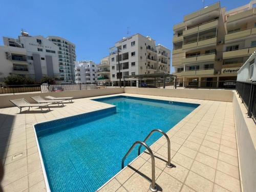 a swimming pool on the roof of a building at Chloris 3- Bedroom Apartment W/Pool in Larnaca in Larnaca