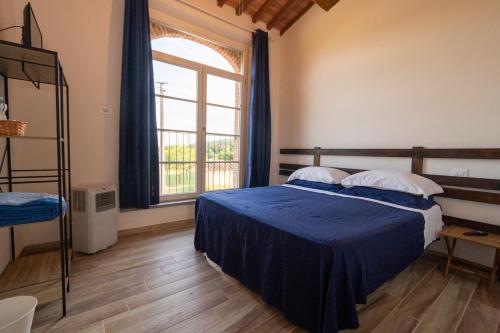 מיטה או מיטות בחדר ב-Corte Volpe Home