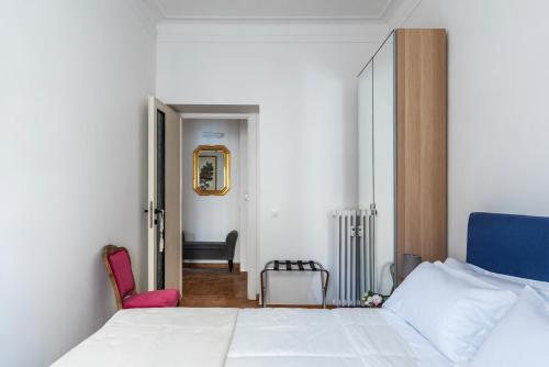 Llit o llits en una habitació de Colosseo Honey Apartment