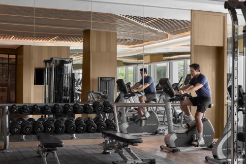 a group of people exercising in a gym at Clark Marriott Hotel in Clark