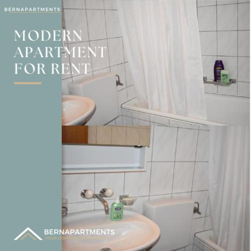 a bathroom with a white toilet and a sink at City-Home: 6P-80qm 6km HB Bern in Zollikofen