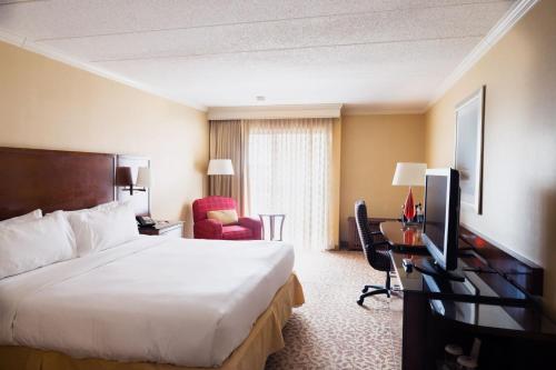 a hotel room with a large bed and a desk at Marriott Providence Downtown in Providence