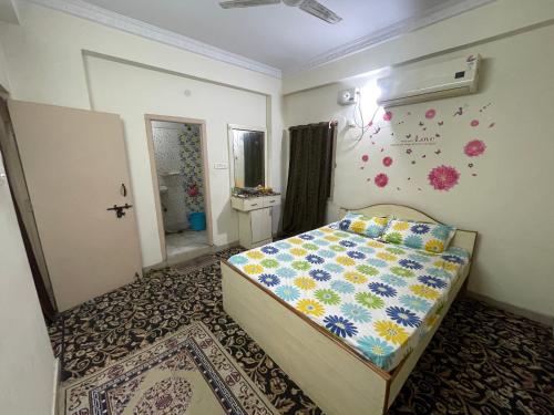 a bedroom with a bed in a room at A to Z Guest House in Hyderabad